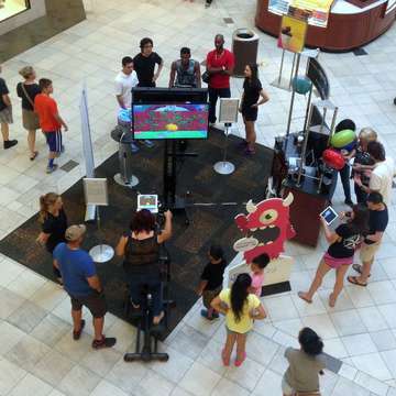 Mall Shoppers Take on Goji Play on Elliptical Trainers